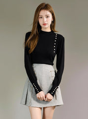 Black Knit Sweater With High Neck and Button Design