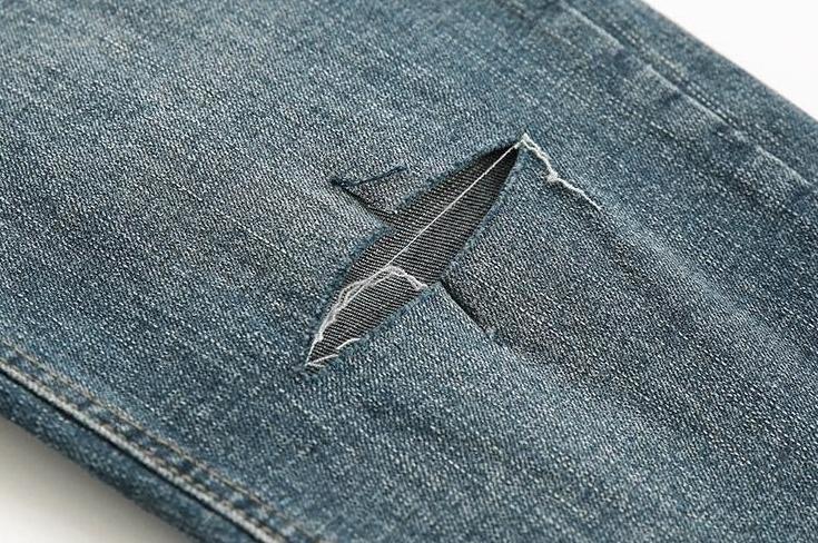 Trendy Tapered Denim Pants With Distressed Design